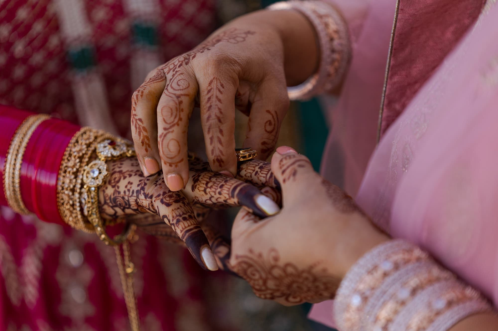 Hands fastening the kalgi before the ceremony, Toronto Sikh wedding