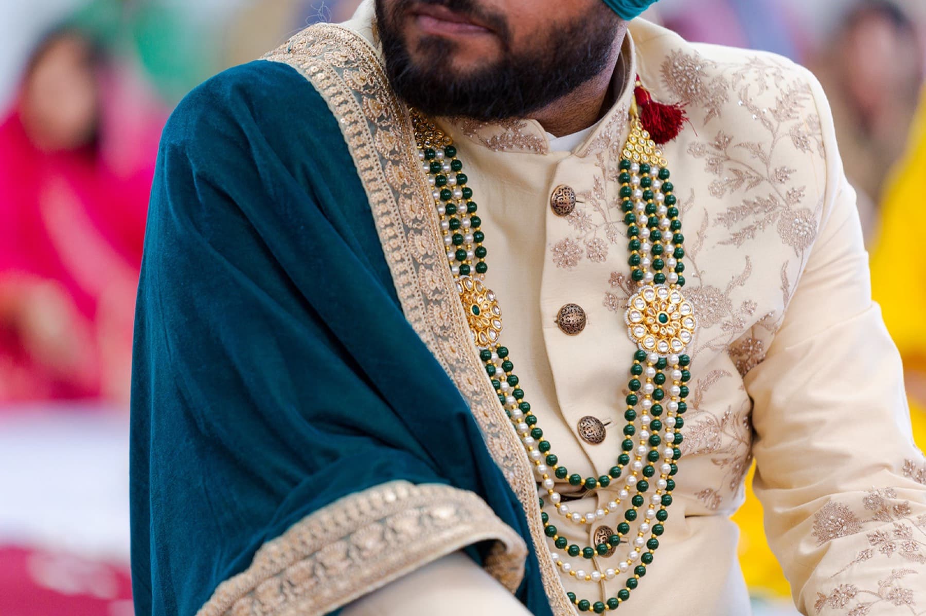 Groom in pearls before the ceremony, Toronto