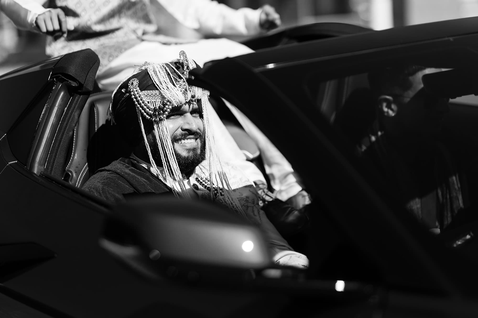Groom arriving by car, black and white, Toronto wedding