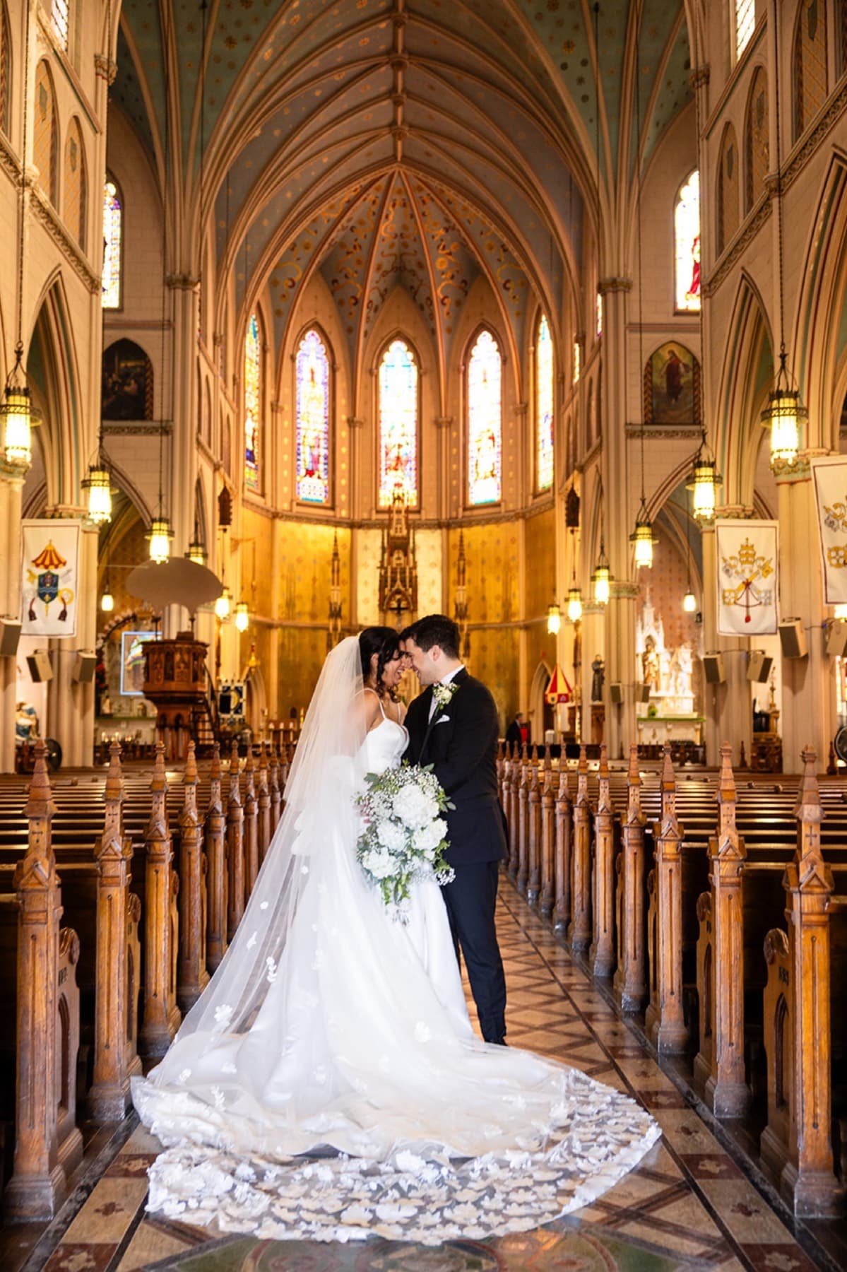 First kiss at the cathedral altar, Toronto church wedding