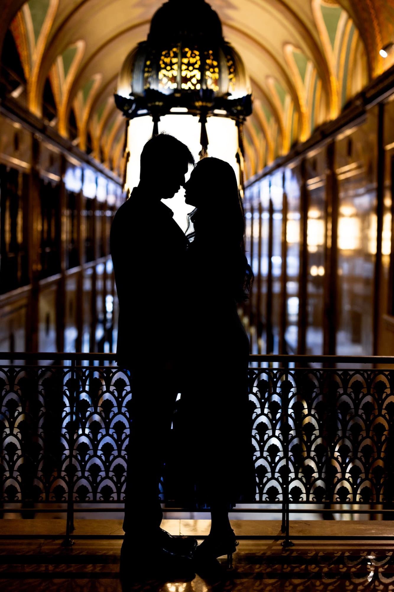 Couple silhouetted in a grand doorway, engagement session, Toronto