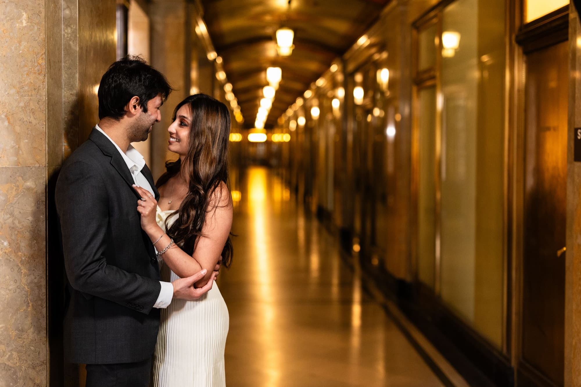 Couple in a lantern-lit corridor, engagement photography, Toronto