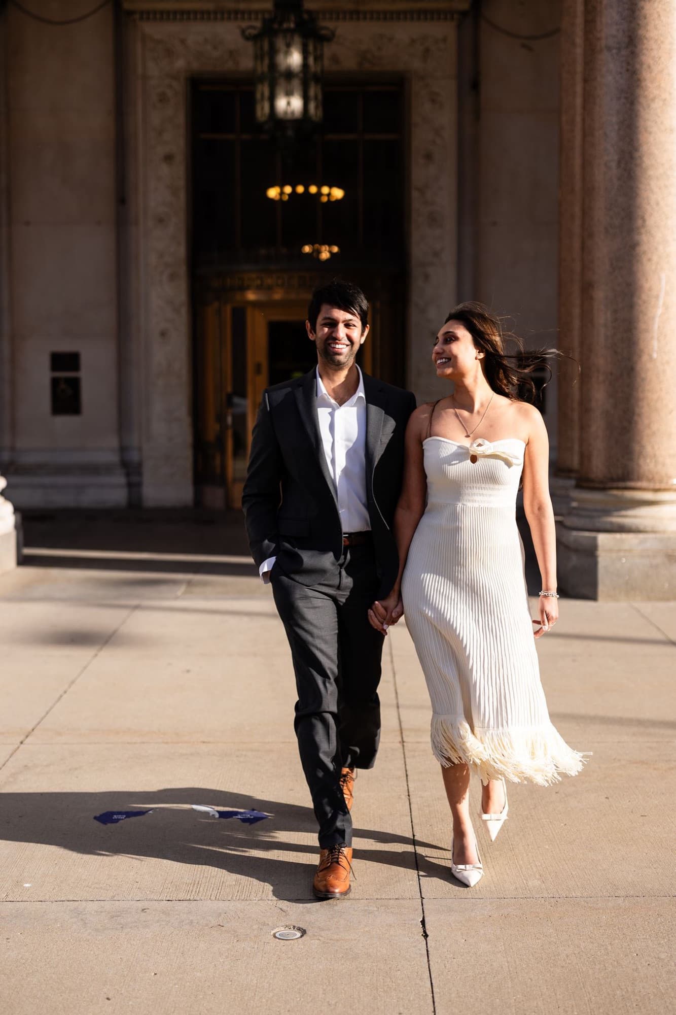 Couple between marble columns, engagement session, Toronto