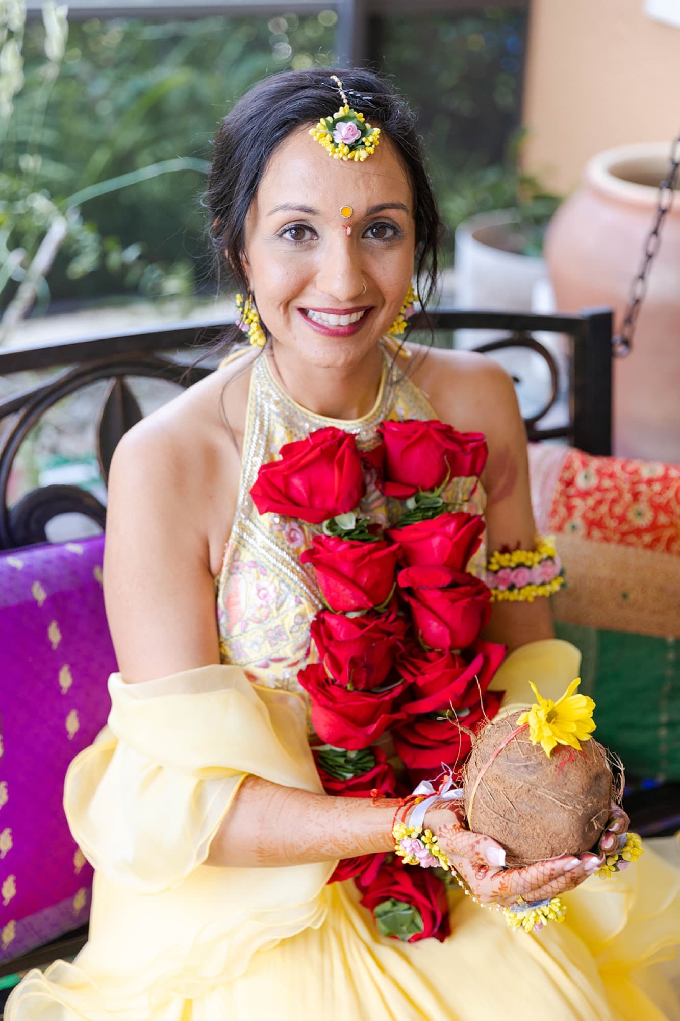Bride laughing in her rose garland at the haldi ceremony, GTA
