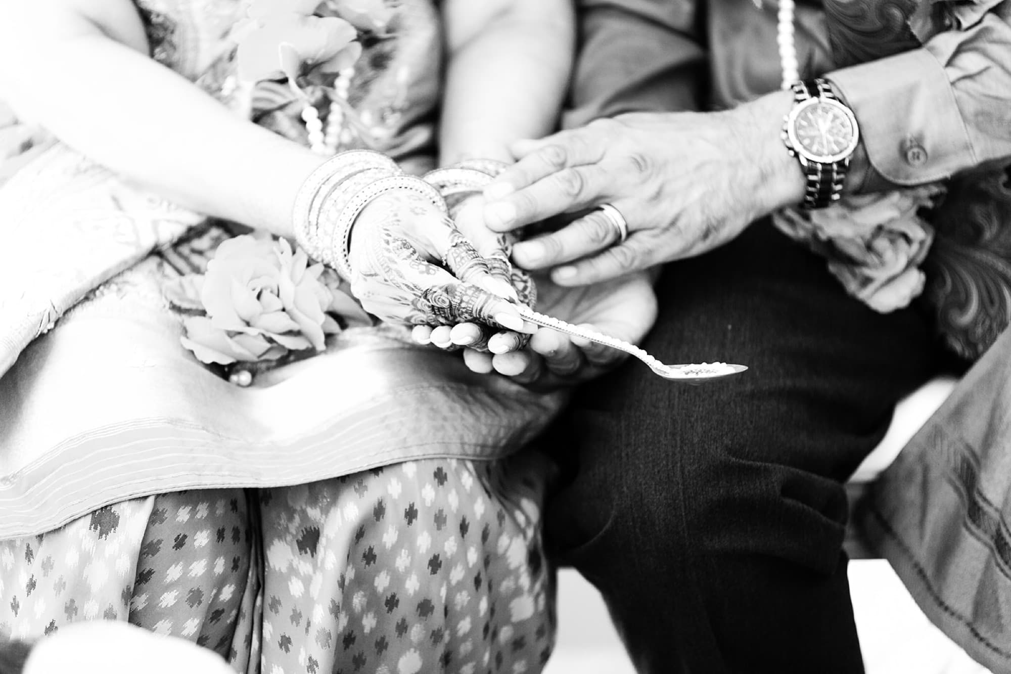 Hands joined in ritual, black and white, GTA wedding photography