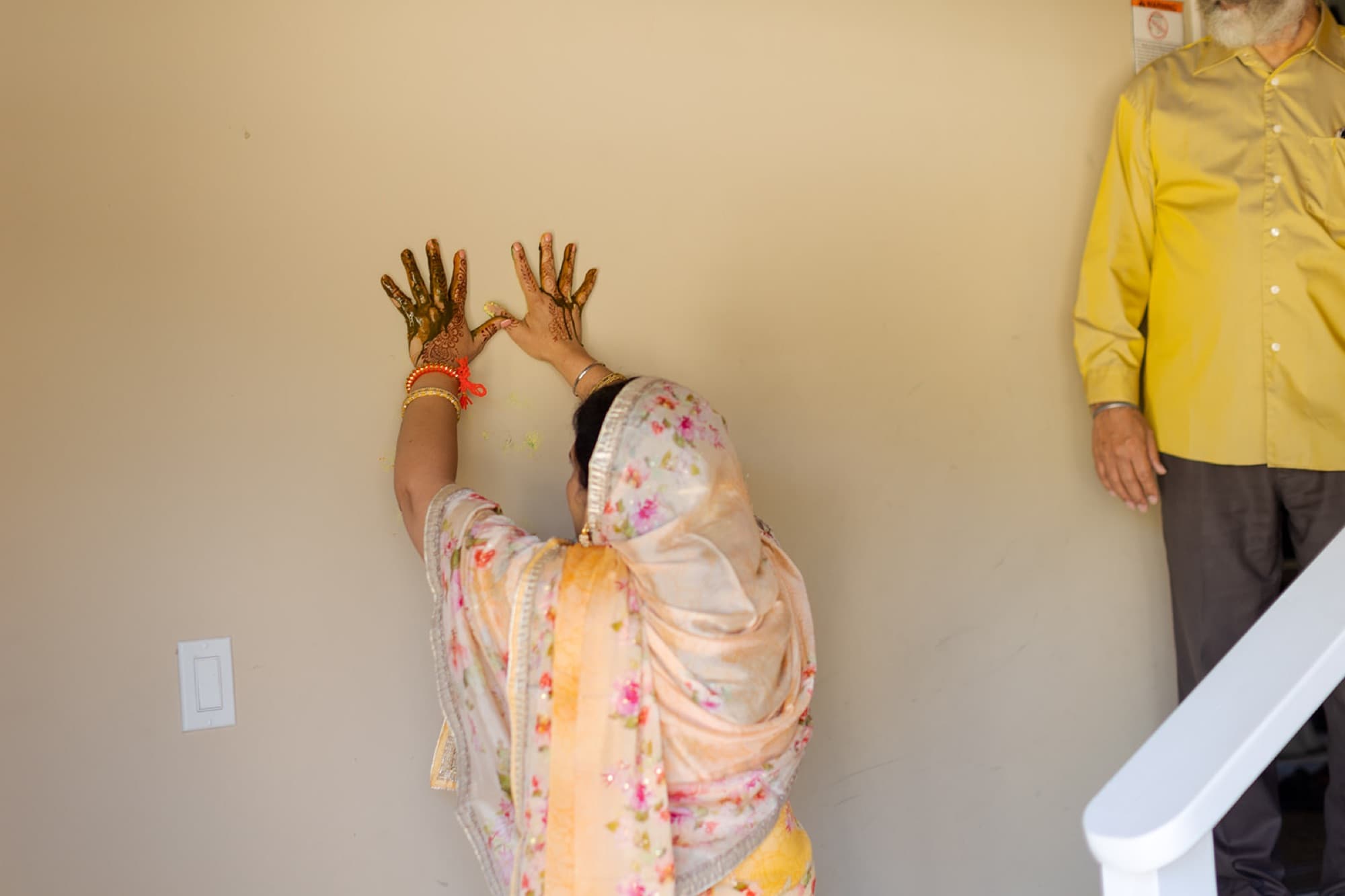 Hands raised in blessing at the haldi, Toronto