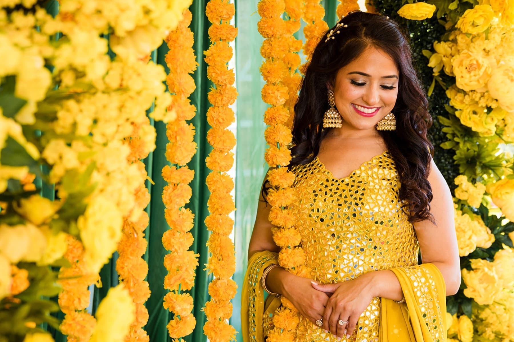 Bride behind marigold garlands at the choora ceremony, GTA