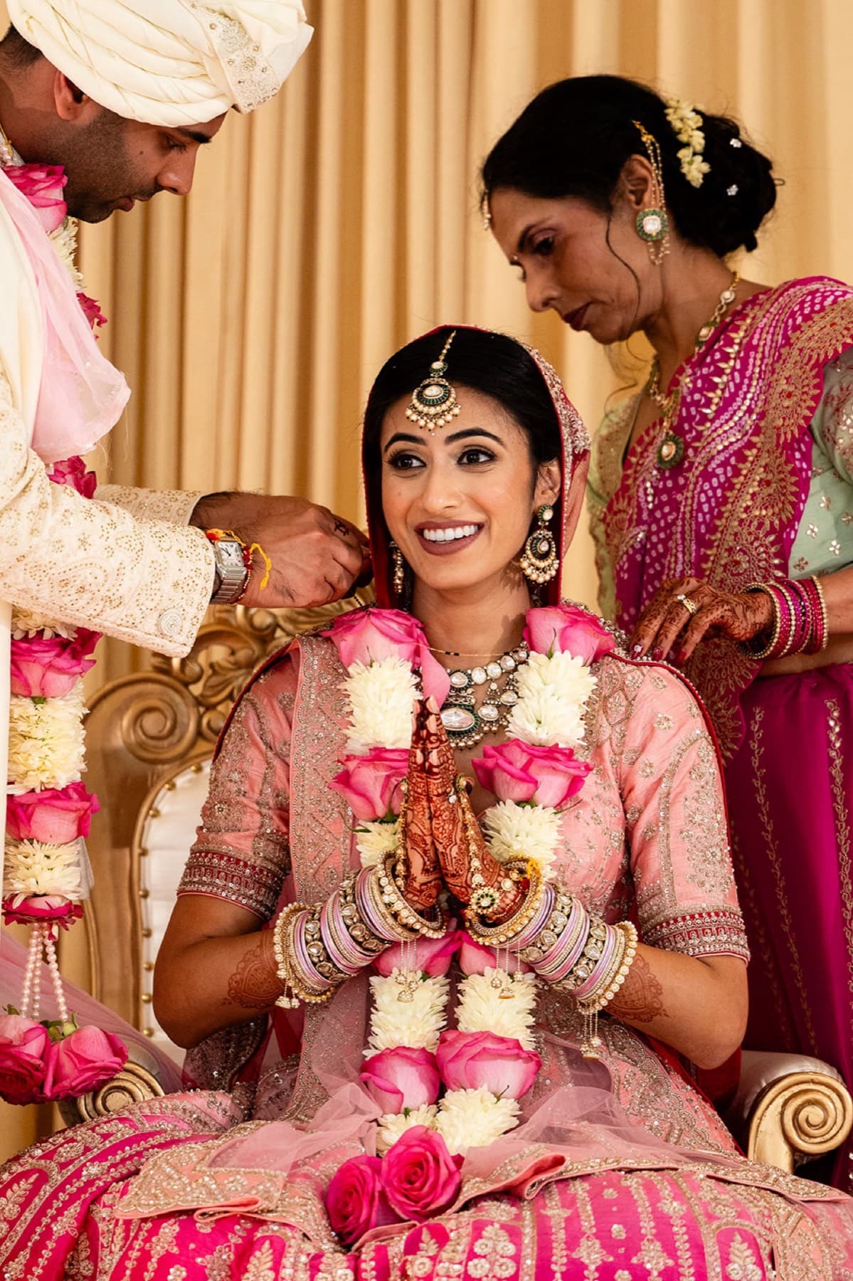 Bride in red with polki jewelry and mehndi, Toronto