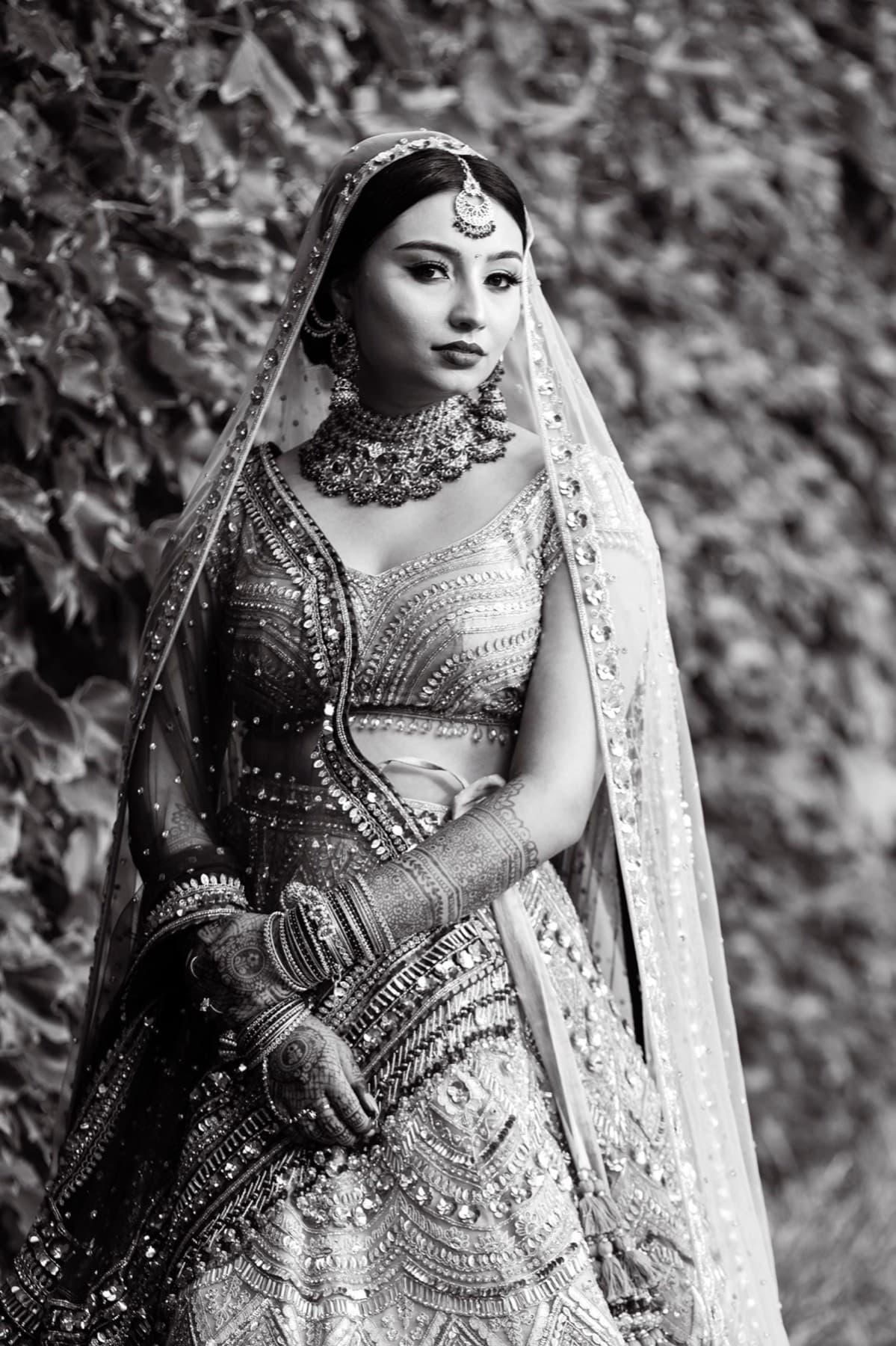 Bride in emerald and gold against the garden wall, GTA wedding