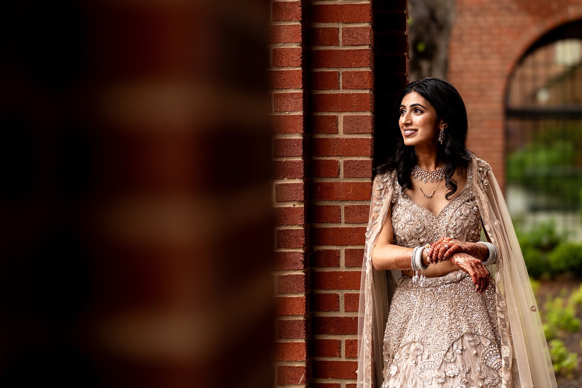 Groom portrait against dark brick before the reception, Toronto