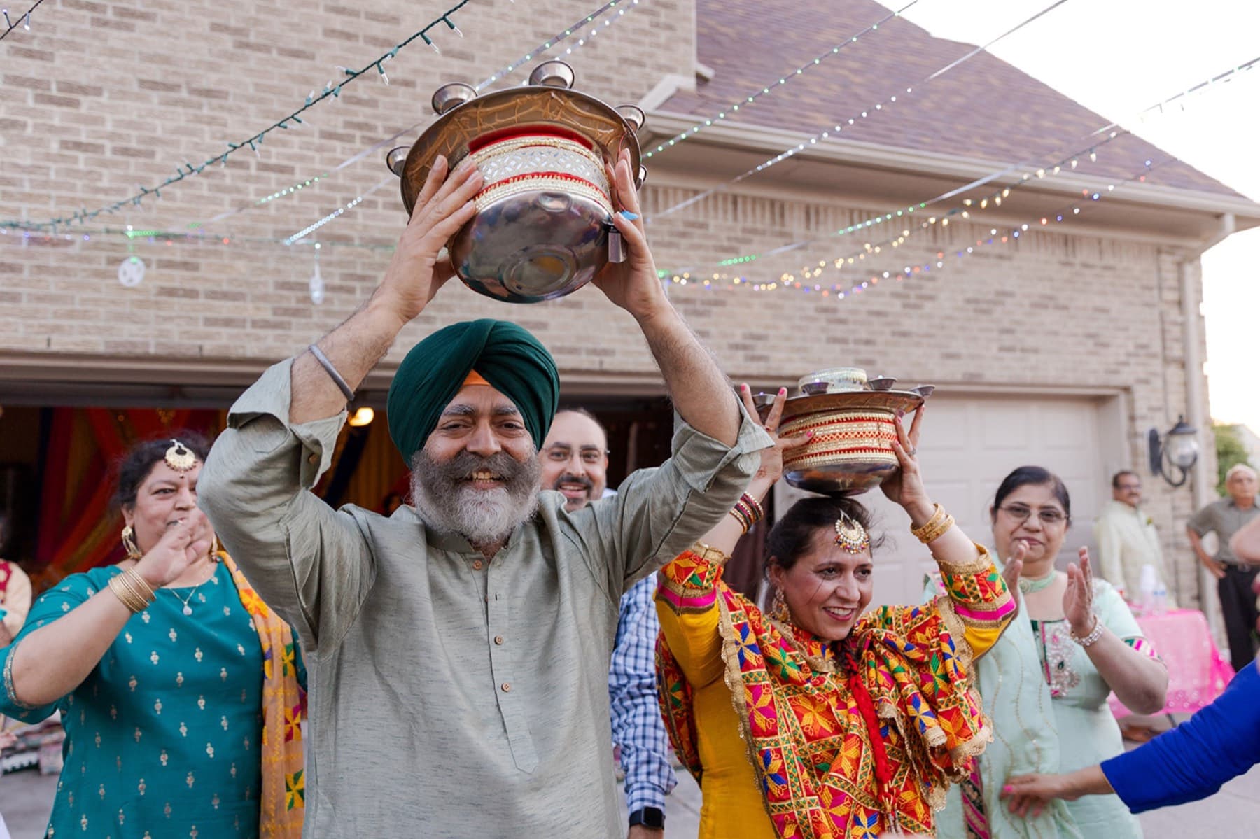 Family raising jaggo pots at the sangeet night, GTA Punjabi wedding