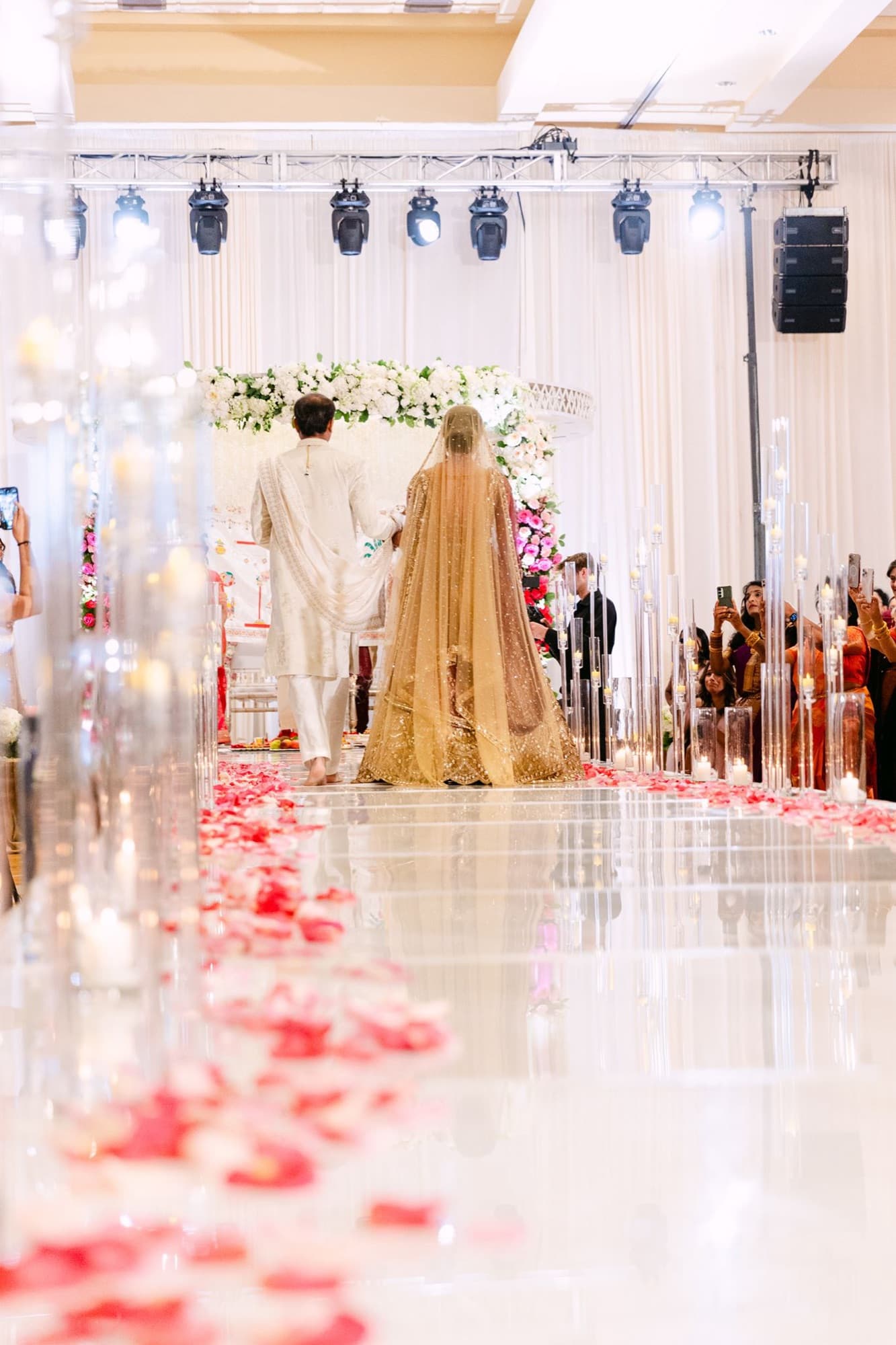 Bride walking the petal-covered aisle, Toronto wedding