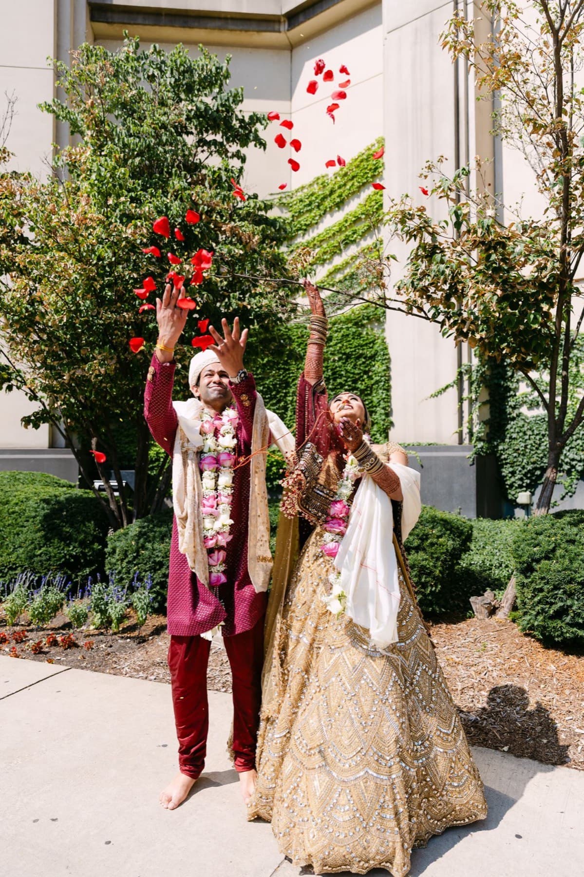 Couple in garlands walking the grounds, Toronto South Asian wedding