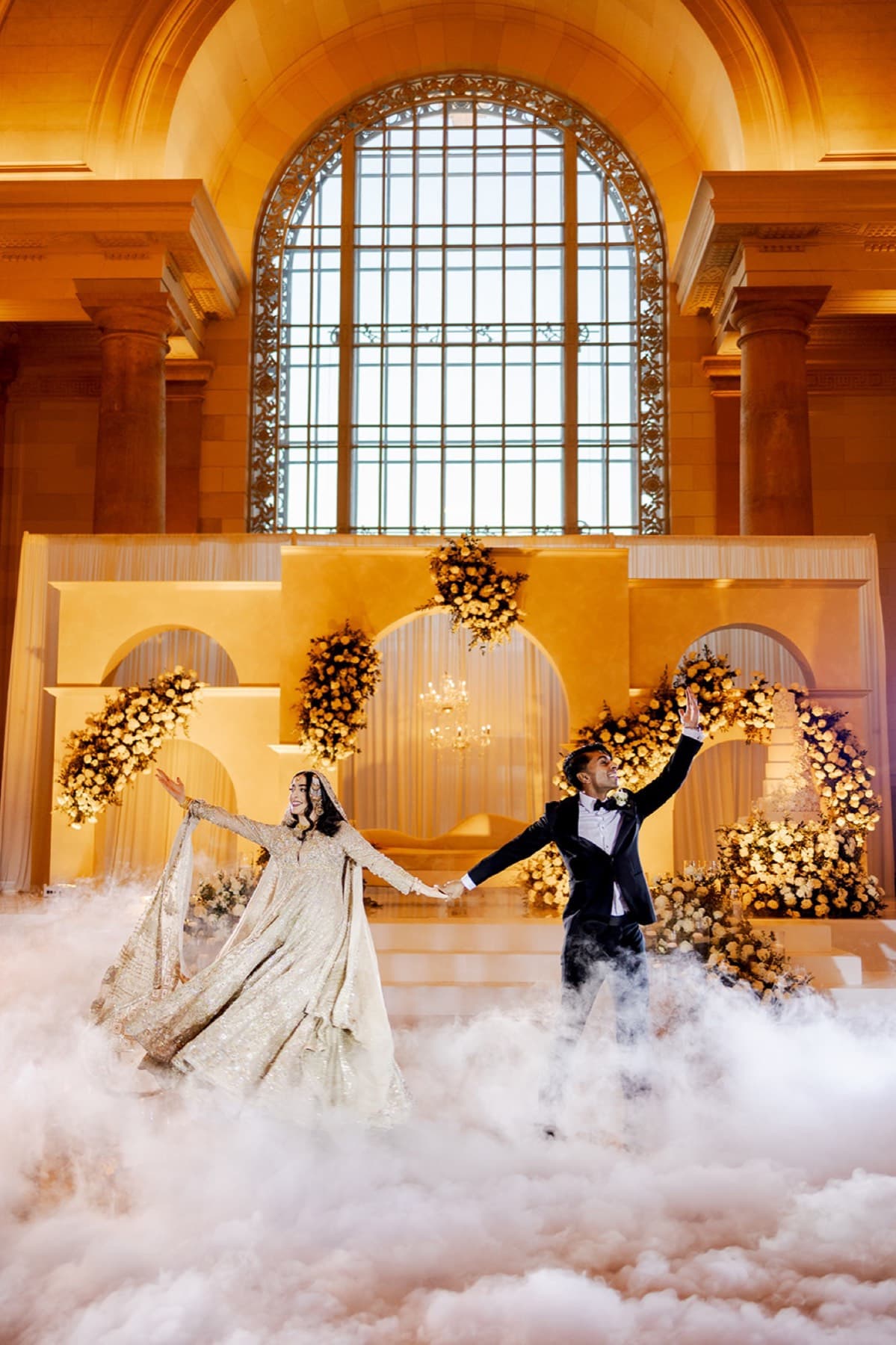 Marigold petals tossed under the gold arches, Toronto celebration