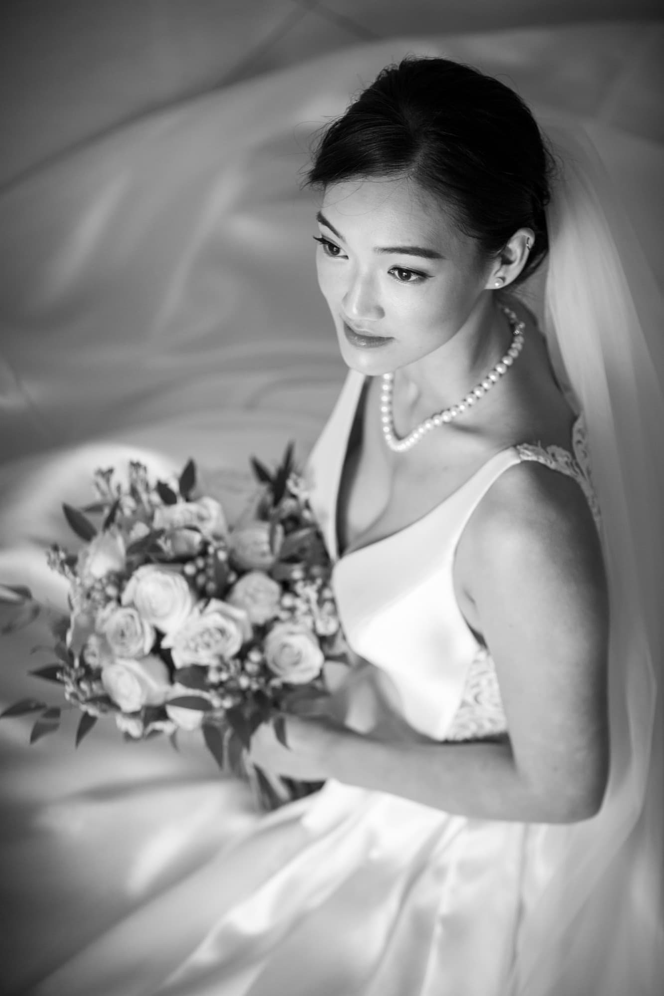 Bridal portrait with bouquet in soft light, Toronto