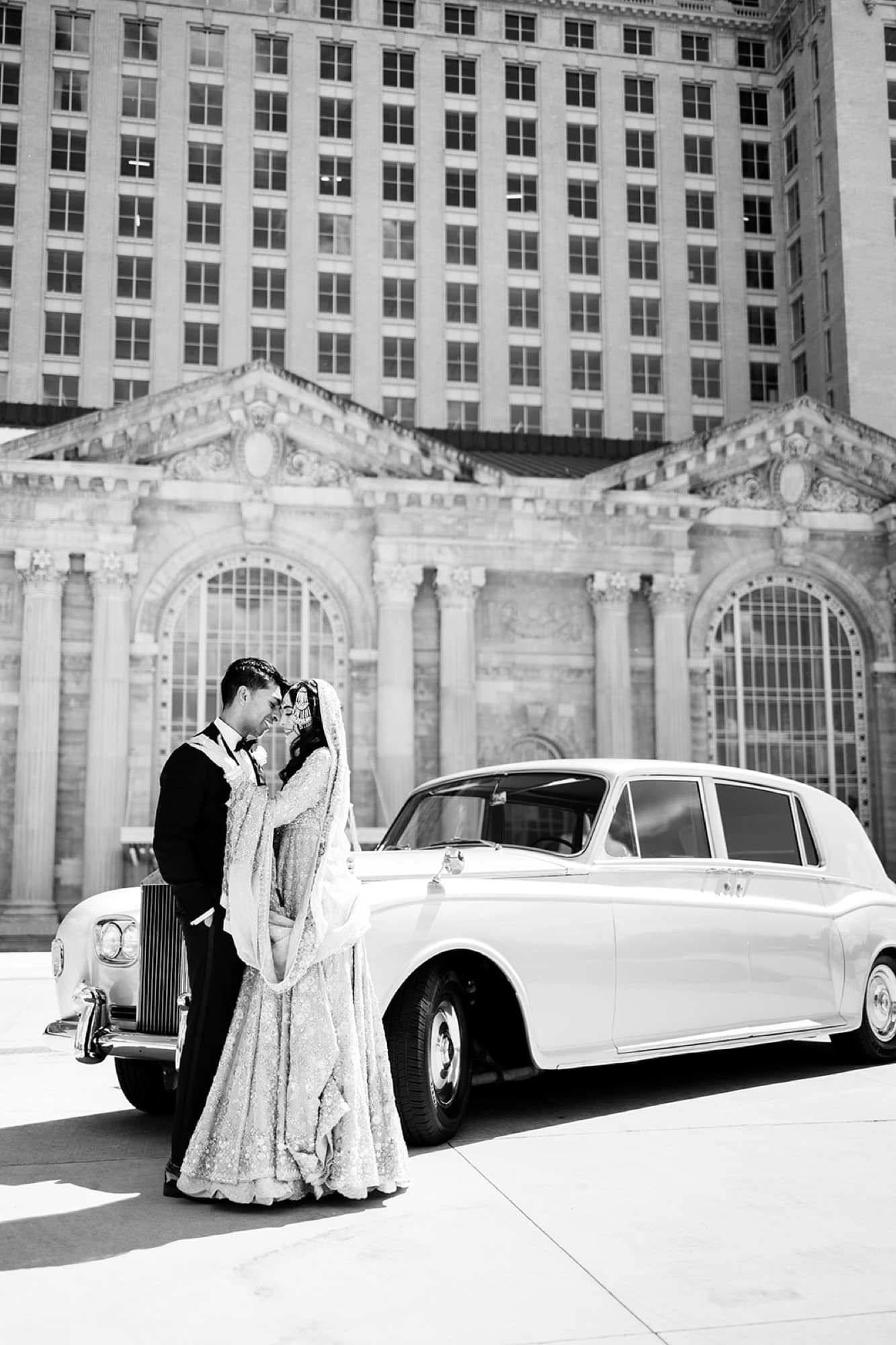 Couple with a vintage car at the chateau, black and white, Toronto