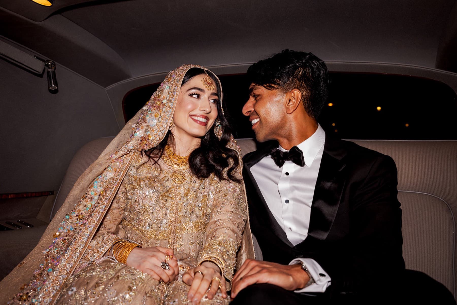 Black tie and gold lehenga at the reception, Toronto wedding