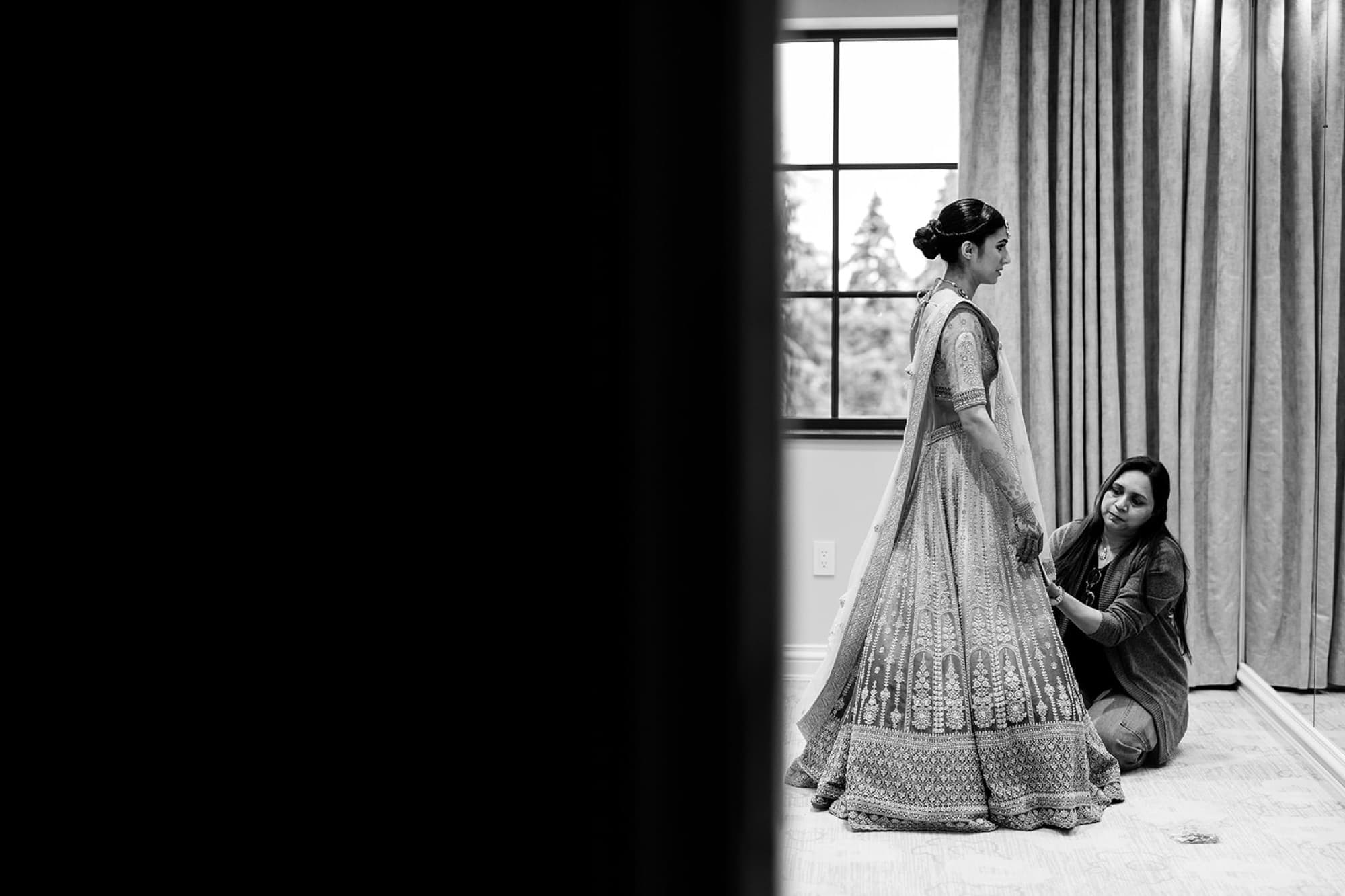 Bride in dramatic window light, editorial lehenga portrait, Toronto