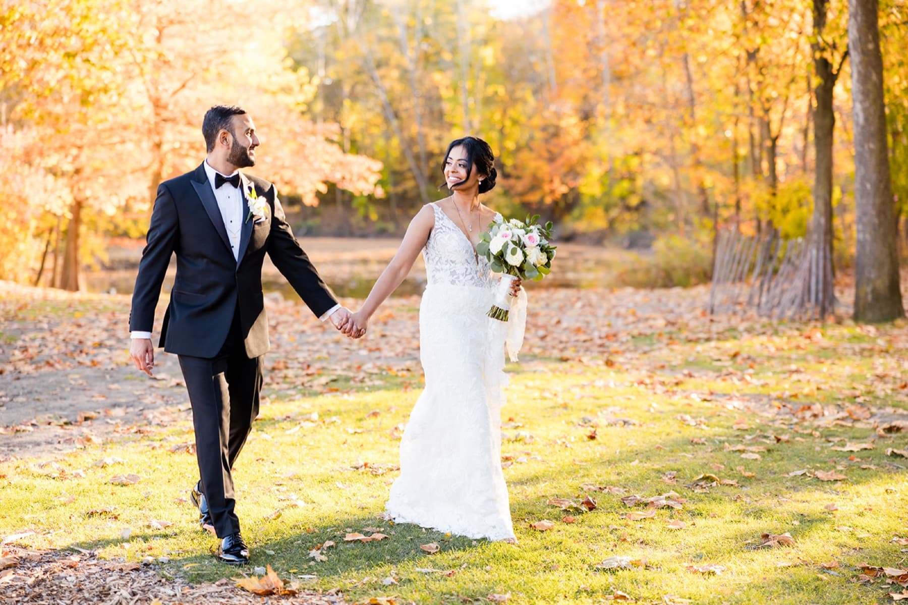 Couple walking the autumn field, golden foliage, Toronto wedding