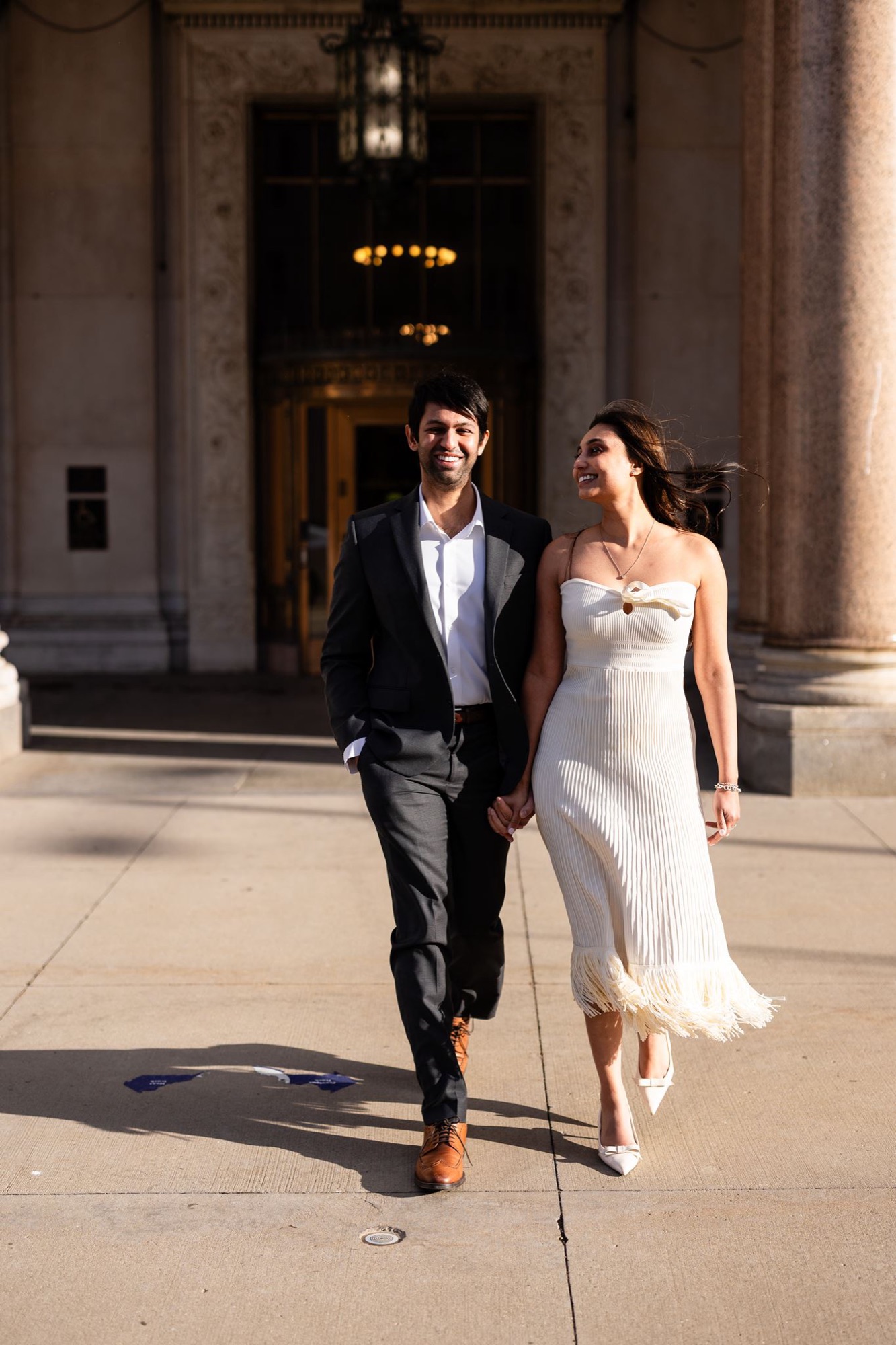 Couple between marble columns, engagement session, Toronto
