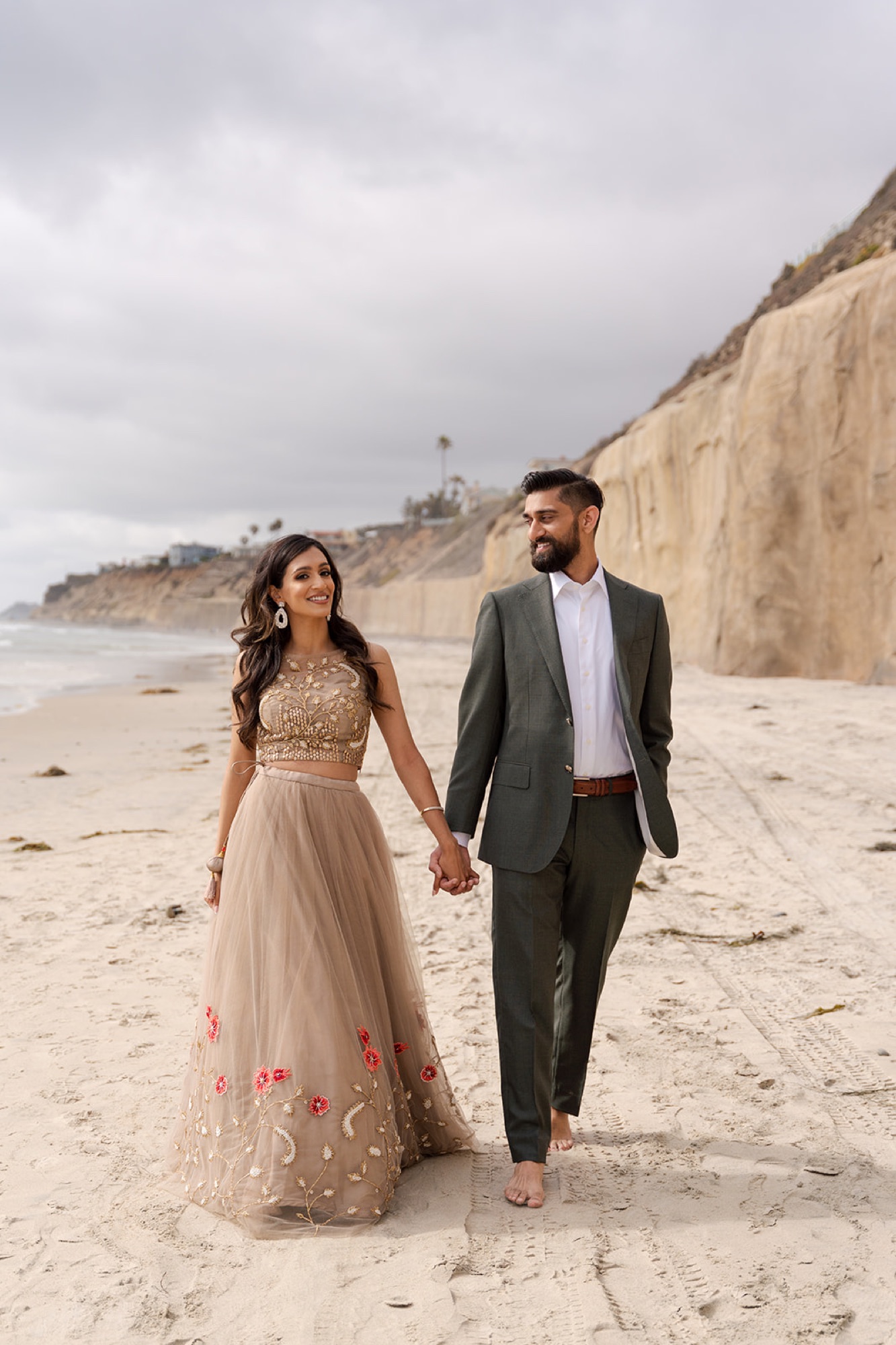 Couple beneath an ornate golden arch, engagement session, Toronto