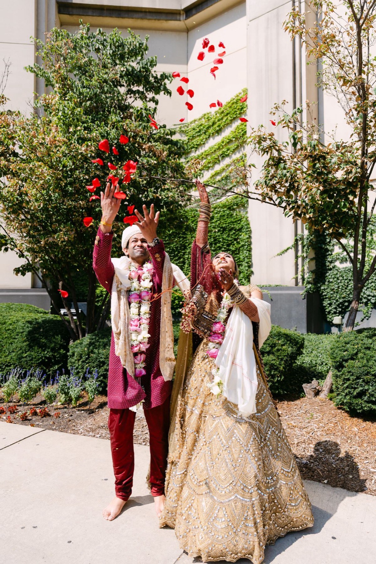 Couple in garlands walking the grounds, Toronto South Asian wedding