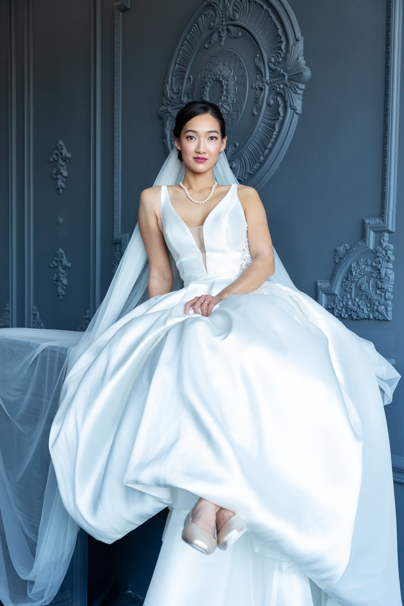 Bride against blue doors, editorial bridal portrait, Toronto